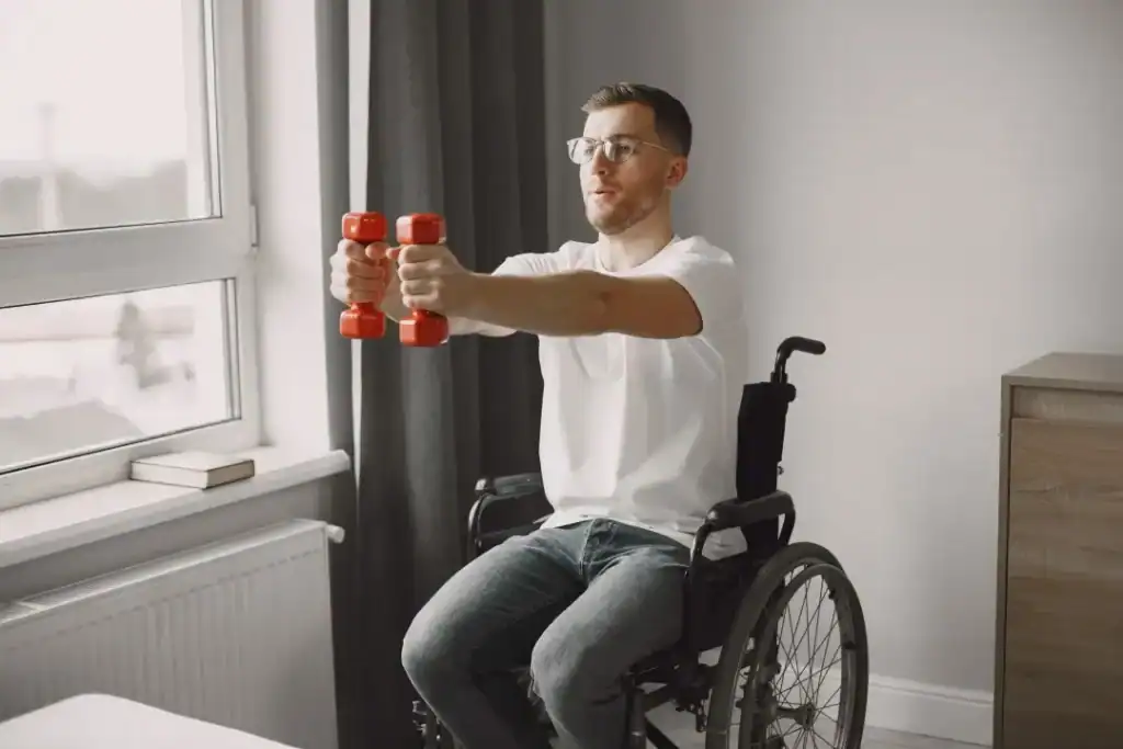 Image of man doing exercise in his wheelchair to aid weight loss Wisley
