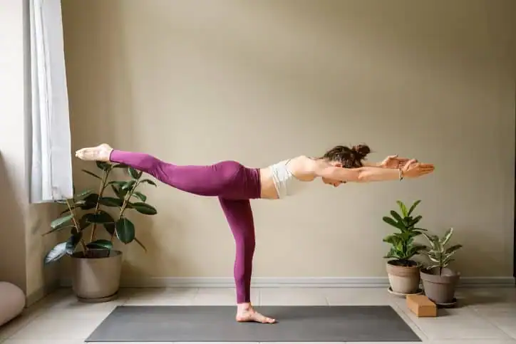 Woman doing Yoga exercise Wisley to help with toning the body. 