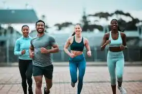 image of man and 3 women doing cardio exercise Wisley to help tone and remove fat from the body.