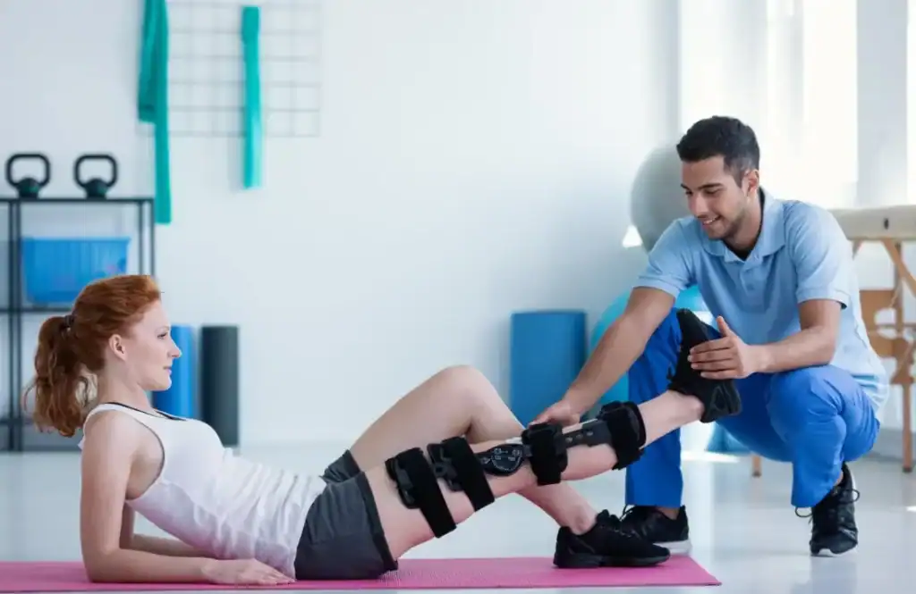 Woman having treatment to help muscle recovery Wisley after an injury