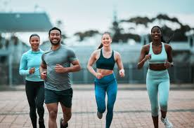 image of people running to incorporate cardio Wisley exercise into their life to help tone arms and body.